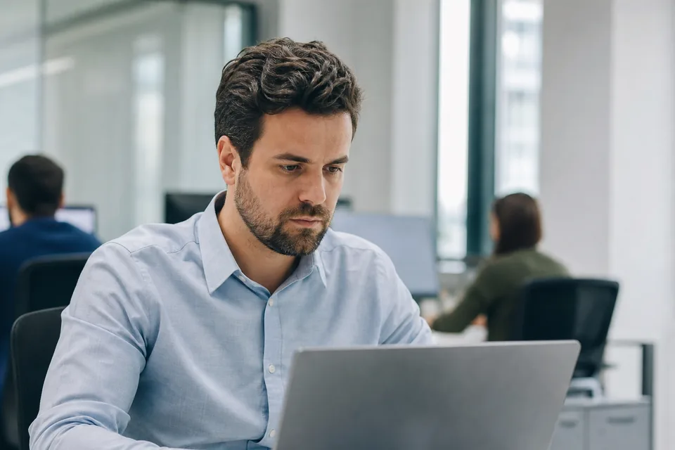 Operations lead checking the segment count of a bulk text on a laptop in a quiet office